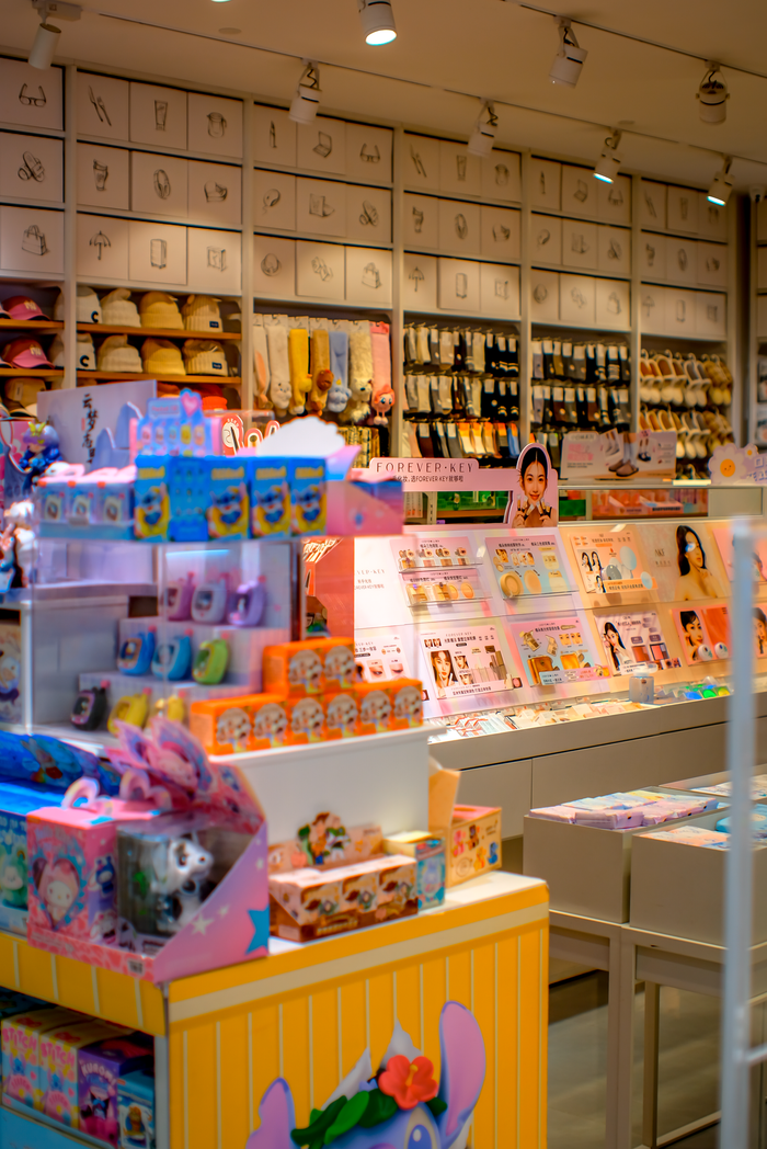 Colorful display in a toy and stationery store, showcasing various products.